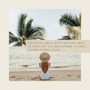 A person in a white swimsuit and straw hat sits on a beach facing the ocean, surrounded by palm trees. Text overlay reads, "Emotional abuse often shows signs of isolation in a relationship, leaving victims feeling alone.