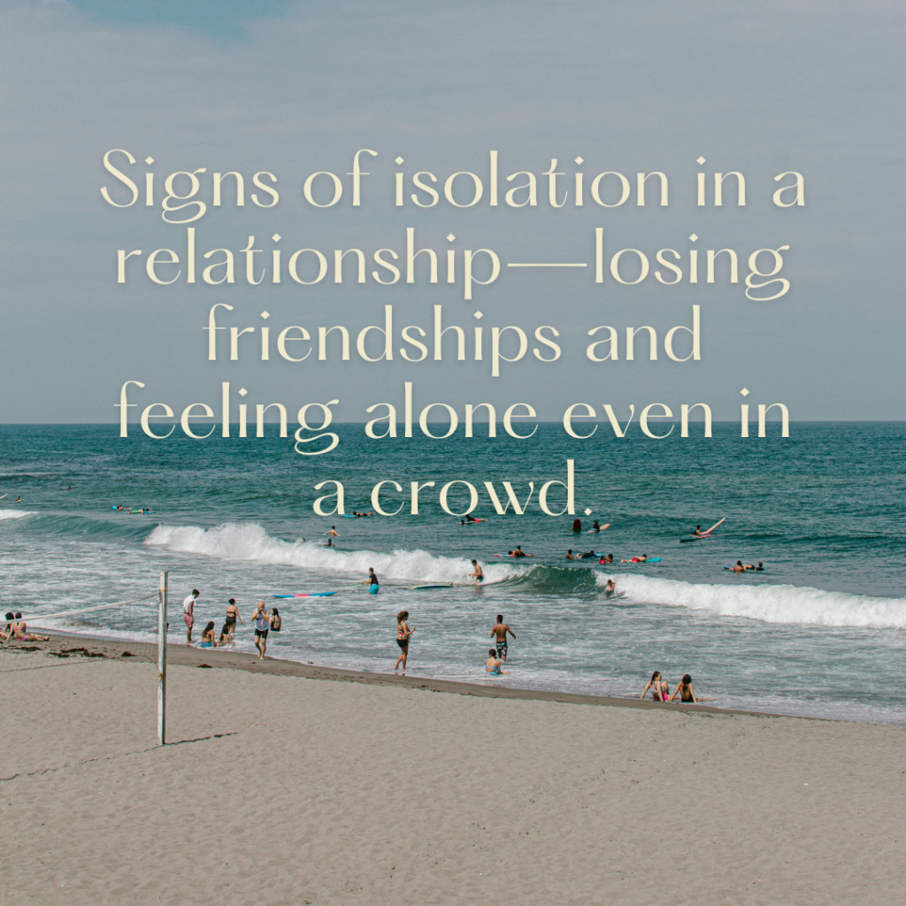 Signs Of Isolation In A Relationship: The Red Flag You Don’t See Until It’s Too Late 1 Under a cloudy sky, people swim and play on the sand. Yet, signs of isolation in a relationship appear—losing friendships and feeling alone even amid the crowd.