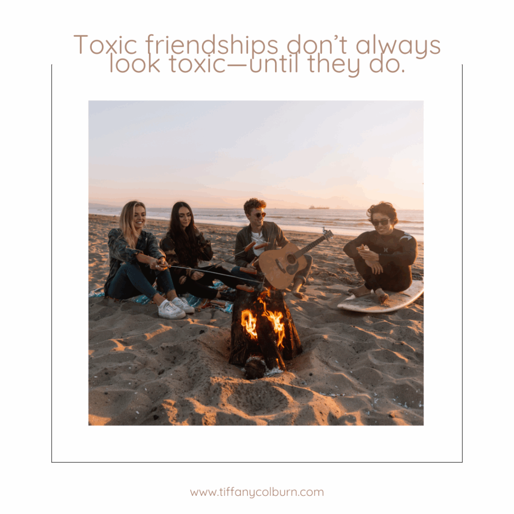 Toxic Teen Friendship: What It Looks Like And How To Heal 1 Four young adults sit around a campfire on a beach at sunset; one holds a guitar. Text above reads, "toxic teen friendship doesn’t always look toxic—until it does. " website link at the bottom: www. Tiffanycolburn. Com.
